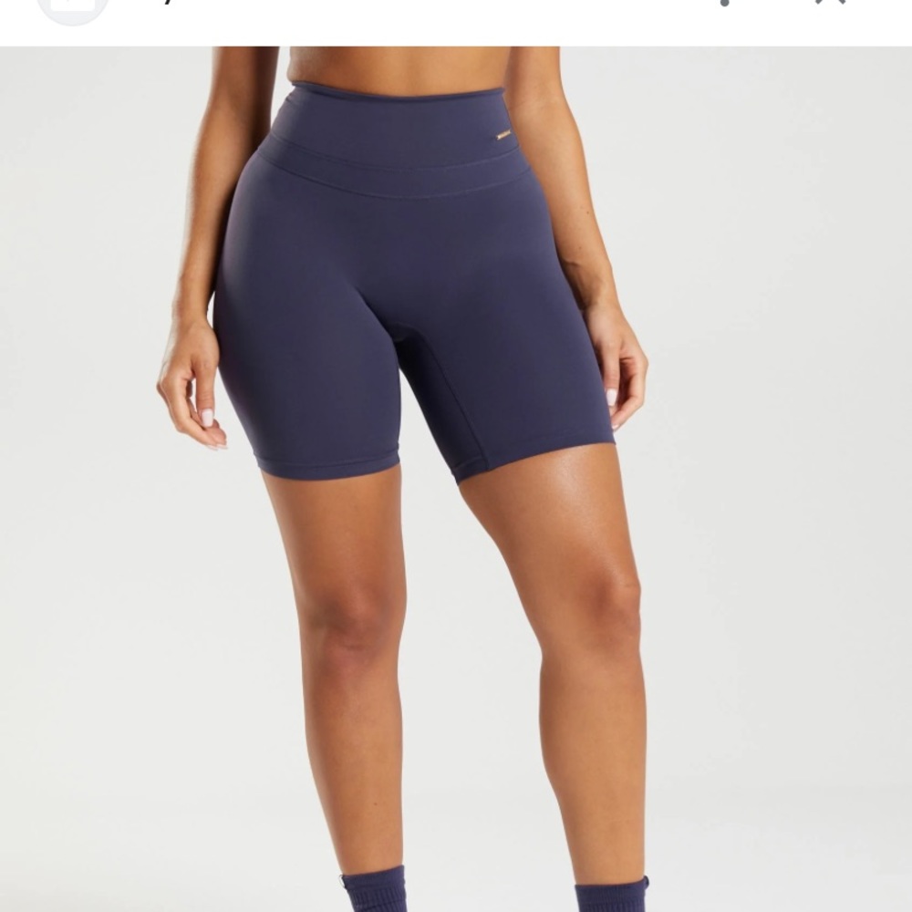 Whitney Simmons Biker shorts in blue/purple color.